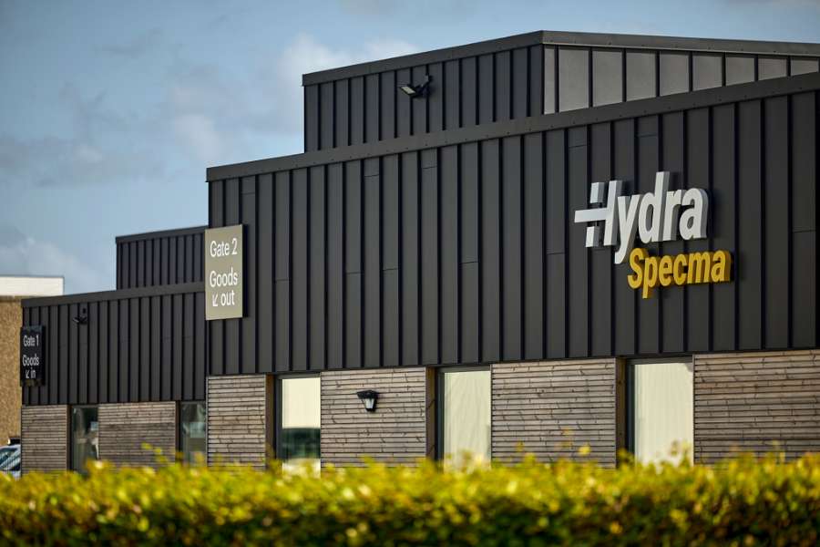 Black steel profiles and warm wood create striking contrasts on headquarters facade, Jernvej 19, 6900 Skjern, Denmark